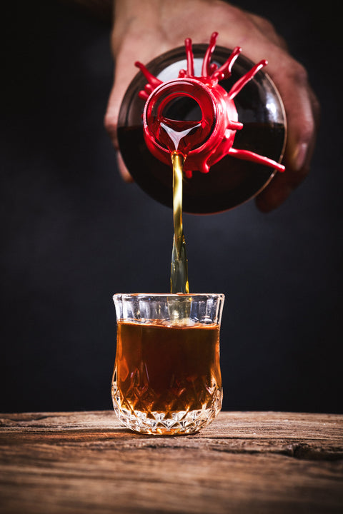 Shot glass being poured 